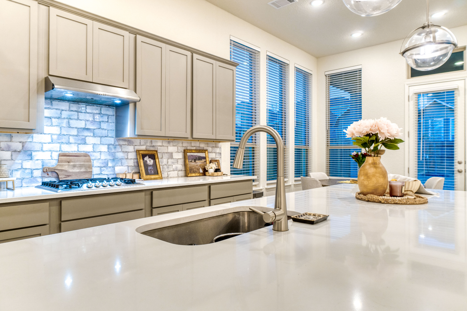 Kitchen island sink with tile backsplash